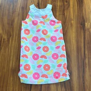 Pink dress with fruit and button in the back and bows on the sides 8 years old